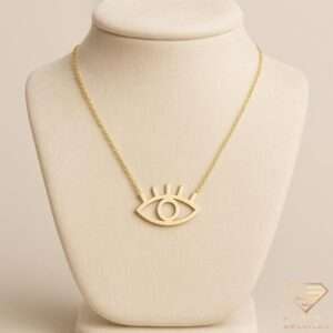 Minimalist gold evil eye pendant necklace with lashes on a delicate chain