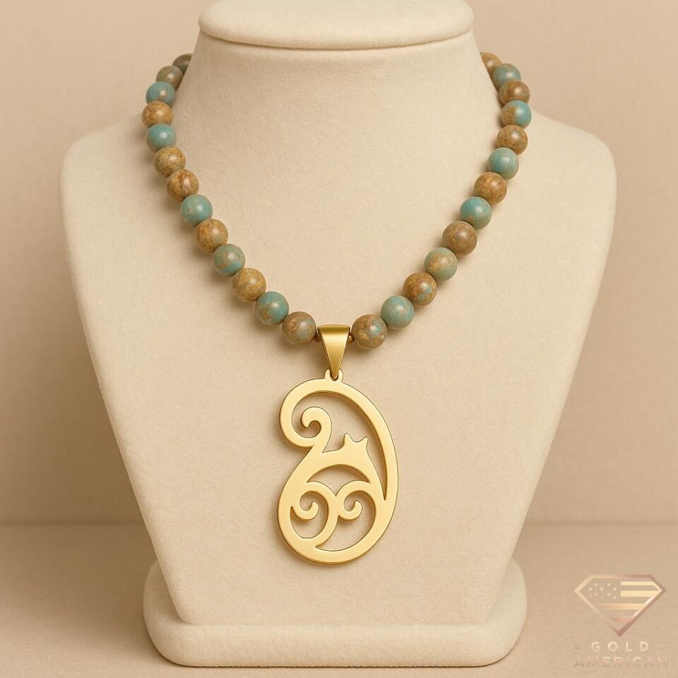 Jasper beaded necklace with solid gold open-work paisley pendant in boho style
