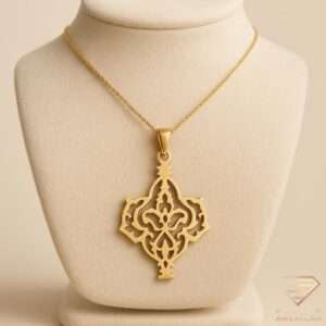 Arabesque gold pendant necklace with open-work Middle Eastern motif on a delicate chain
