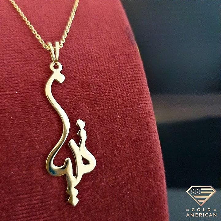 Arabic Calligraphy Gold Pendant on a red velvet jewelry display