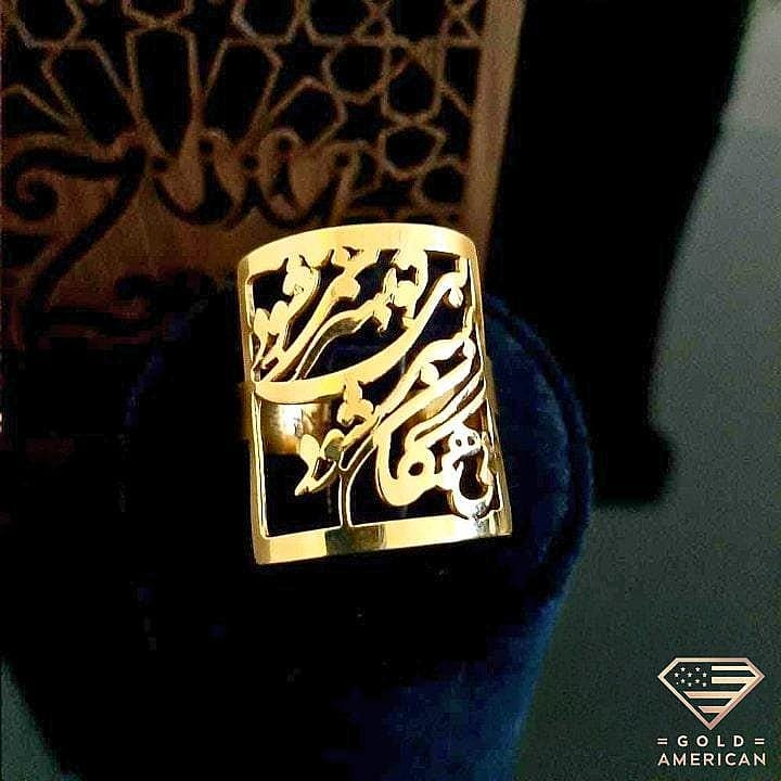 Calligraphic Gold Ring on a ring stand