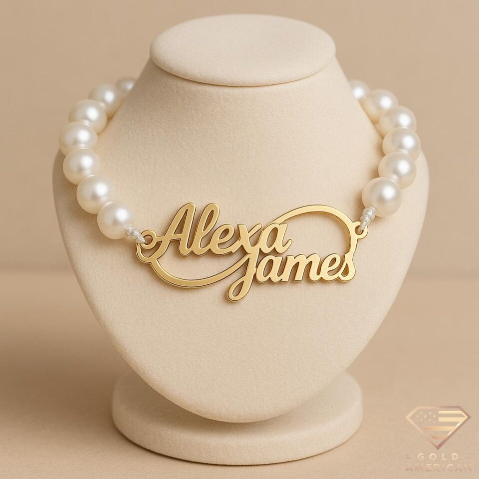 Custom gold name bracelet with pearl beads featuring engraved “Alexa James” design — personalized luxury jewelry.