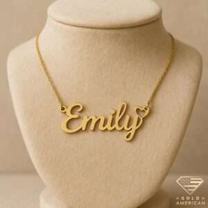 Gold script name necklace “Emily” with heart accent on delicate chain