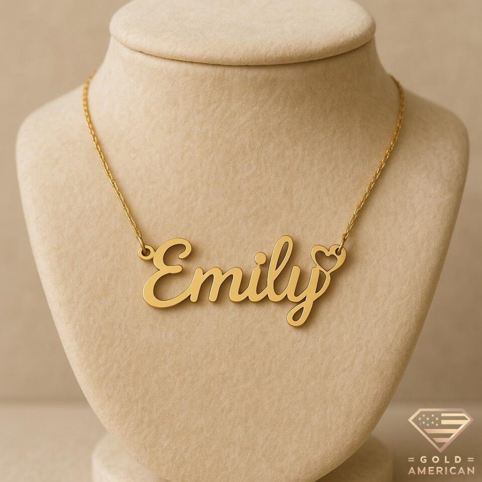 Gold script name necklace “Emily” with heart accent on delicate chain