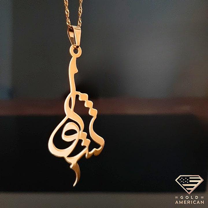 Custom Arabic Calligraphy Gold Pendant on a black display