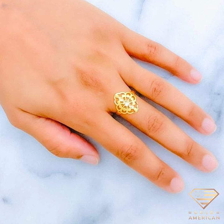Intricate Gold Ring worn on the hand