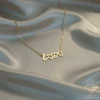 Love Necklace Gold on Satin