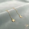 Moon and Star Gold Drop Earrings Close Up