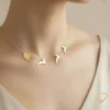 Santa Sleigh & Reindeer Gold Necklace Model Close up