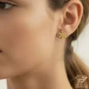 Snowflake Gold Earrings Model Close up