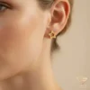 Star Gold Earrings Model Close up