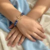 Gold Angel & Blue Lapis Bracelet for Kids on Hand Close up