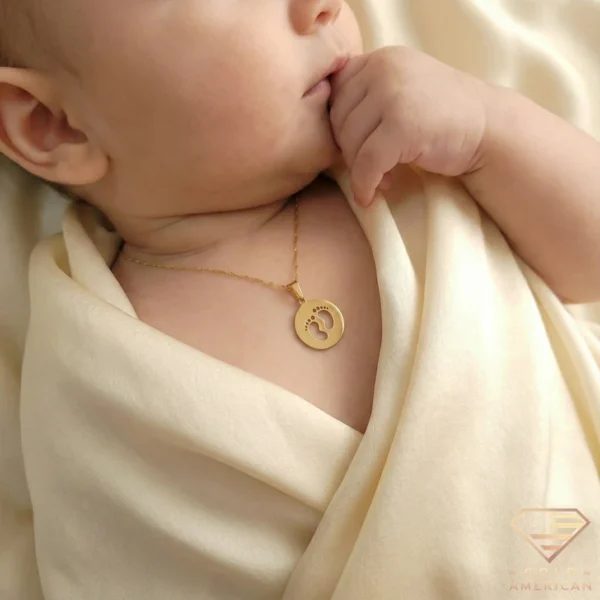 Gold Baby Footprints Medallion Necklace on Baby
