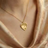 Gold Heart Hugging Girl Necklace Model Close up