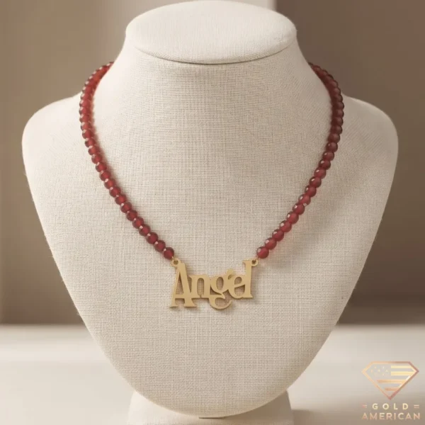 Angel Gold Nameplate Garnet Beaded Necklace displayed on a jewelry bust