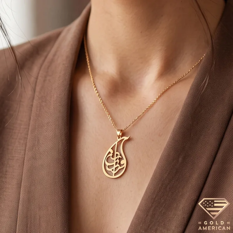 https://gold-american.com/wp-content/uploads/2026/10/Farzaneh-Teardrop-Framed-Script-Necklace-video.webm